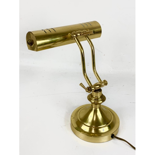 68 - A vintage brass adjustable desk lamp. 36cm.