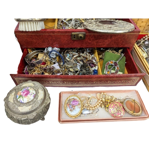 695 - A large quantity of costume jewellery, watches, paper weights, etc.