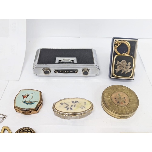 705 - Sundry lot of costume jewellery, compact ash holders, opera glasses, and musical key ring.