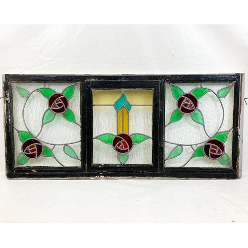 73 - A large Victorian stained glass panel in wooden frame. 157.5 x 68.5cm.