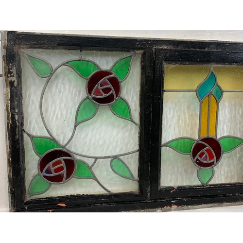 73 - A large Victorian stained glass panel in wooden frame. 157.5 x 68.5cm.