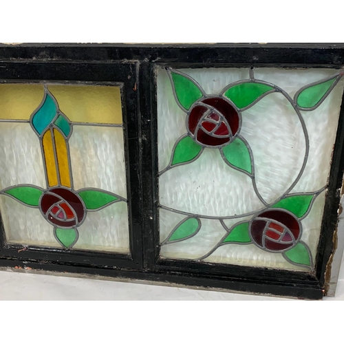 73 - A large Victorian stained glass panel in wooden frame. 157.5 x 68.5cm.