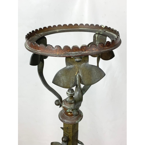 74 - An early 20th century Art Nouveau brass standard lamp base. 152.5cm.