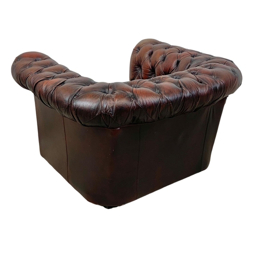 787 - A vintage deep button ox-blood leather Chesterfield club armchair. 104 x 86 x 63cm.