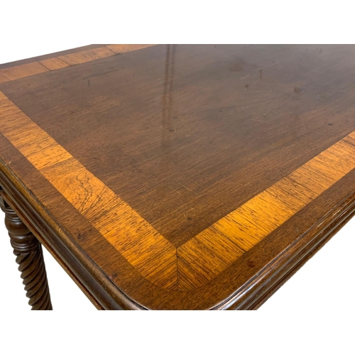 793 - A Regency mahogany tea table with rosewood cross banding, Nelson Twist legs, and quality reeded bras... 