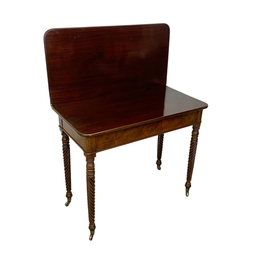 793 - A Regency mahogany tea table with rosewood cross banding, Nelson Twist legs, and quality reeded bras... 