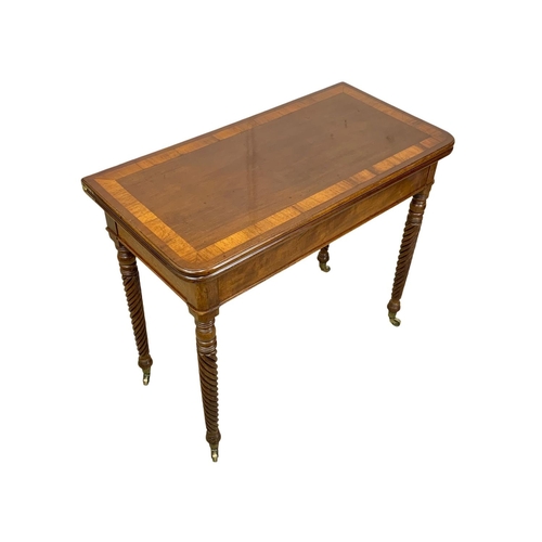 793 - A Regency mahogany tea table with rosewood cross banding, Nelson Twist legs, and quality reeded bras... 