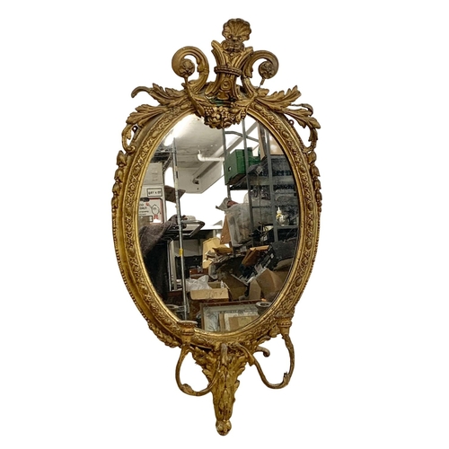 794 - A late Regency gilded Girandole mirror. Circa 1820-1830. 56 x 107cm.