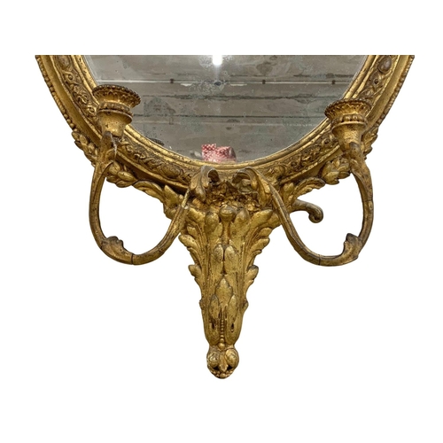 794 - A late Regency gilded Girandole mirror. Circa 1820-1830. 56 x 107cm.