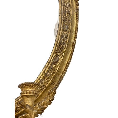 794 - A late Regency gilded Girandole mirror. Circa 1820-1830. 56 x 107cm.