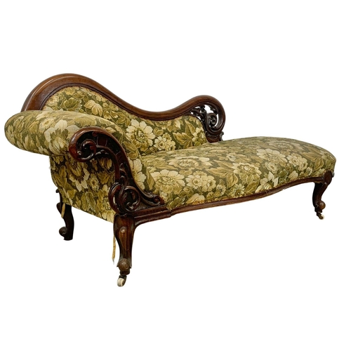 803 - A Victorian carved mahogany chaise lounge with Cabriole legs. Circa 1870. 199cm.