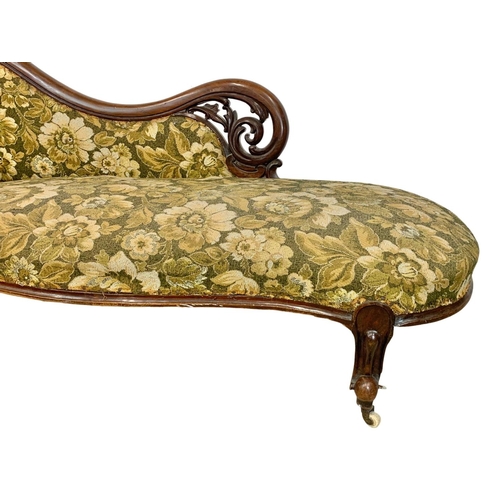 803 - A Victorian carved mahogany chaise lounge with Cabriole legs. Circa 1870. 199cm.