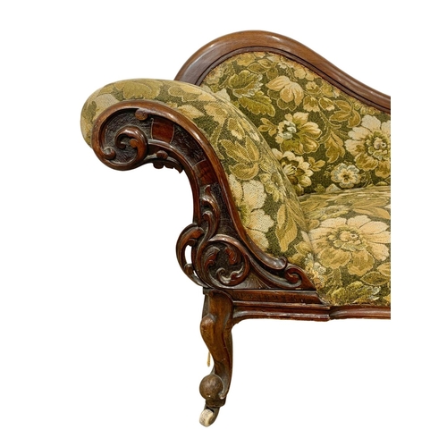 803 - A Victorian carved mahogany chaise lounge with Cabriole legs. Circa 1870. 199cm.