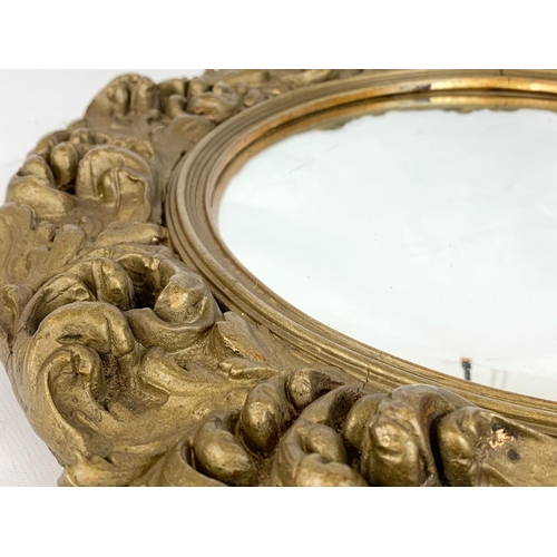 81 - A vintage ornate gilt framed mirror 46cm.