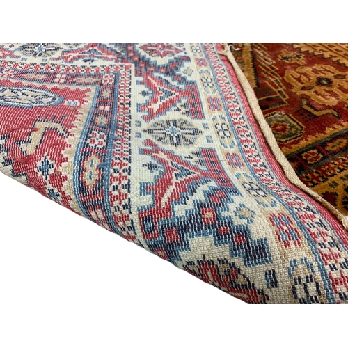 815 - A vintage hand knotted Middle Eastern style rug. 121.5 x 188cm.