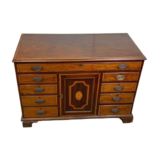 817 - A large late 18th century inlaid mahogany chest of drawers with inlaid panel door. In the Sheraton s... 