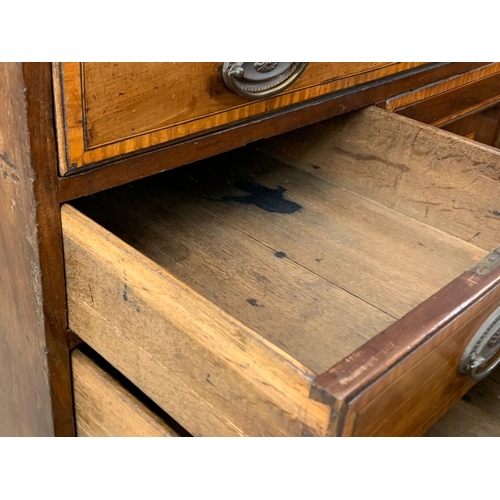 817 - A large late 18th century inlaid mahogany chest of drawers with inlaid panel door. In the Sheraton s... 