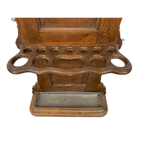 819 - A late 19th century Continental oak hallstand. Circa 1890. 71 x 222cm