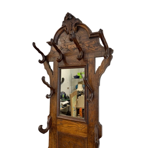 819 - A late 19th century Continental oak hallstand. Circa 1890. 71 x 222cm