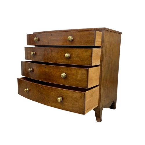 829 - A large Georgian mahogany bow front chest of drawers. Circa 1800-1820. 115.5 x 59 x 105cm.