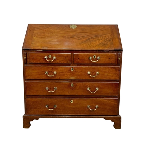 834 - A large Georgian mahogany writing bureau with brass drop handles. Circa 1760-80. 102.5 x 56.5 x 109.... 