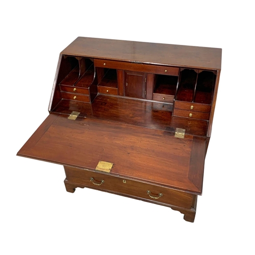 834 - A large Georgian mahogany writing bureau with brass drop handles. Circa 1760-80. 102.5 x 56.5 x 109.... 