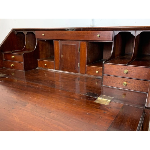 834 - A large Georgian mahogany writing bureau with brass drop handles. Circa 1760-80. 102.5 x 56.5 x 109.... 