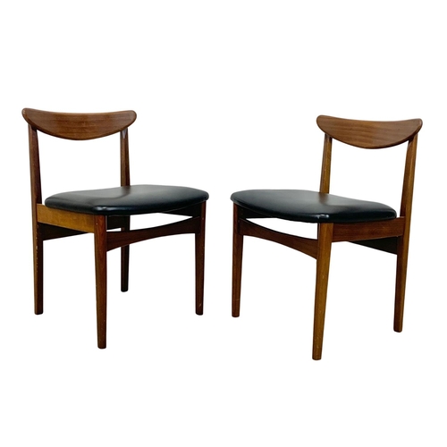 838 - A set of 6 teak dining chairs with black vinyl seats. Mid Century. Circa 1960.