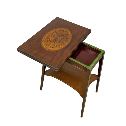 841 - An Edwardian inlaid mahogany turnover games table. 55.5 x 37 x 69.5cm.