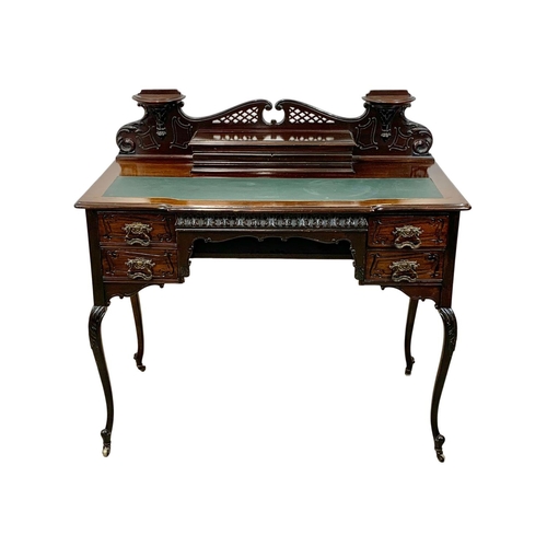 842 - A late Victorian mahogany ladies desk. With Cabriole legs, leather top, stationary compartment and R... 