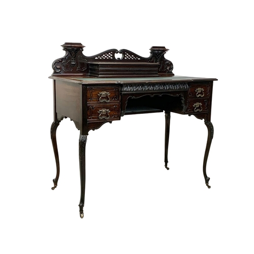 842 - A late Victorian mahogany ladies desk. With Cabriole legs, leather top, stationary compartment and R... 