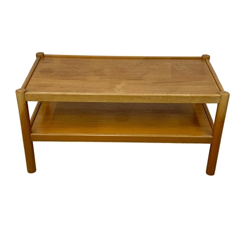 845 - A 2 tier Mid Century coffee table. 94.5 x 48.5 x 46cm