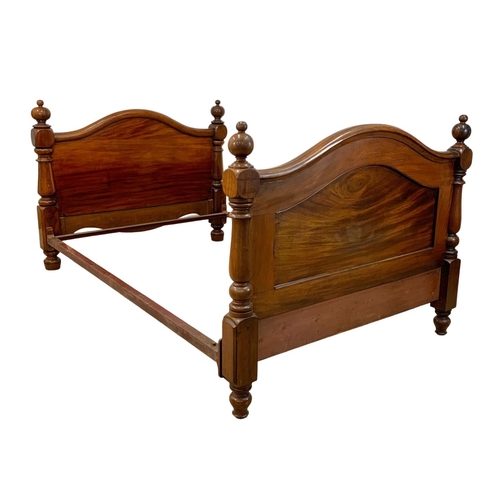 848 - A Victorian heavy mahogany double bed. 134.5 x 214 x 105cm