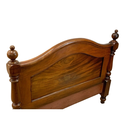 848 - A Victorian heavy mahogany double bed. 134.5 x 214 x 105cm