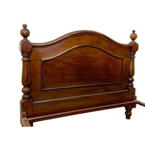 848 - A Victorian heavy mahogany double bed. 134.5 x 214 x 105cm