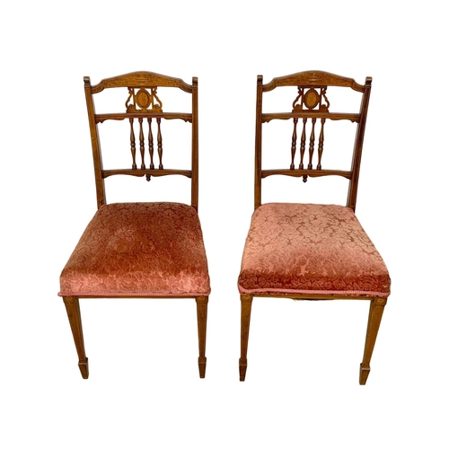 849 - A pair of Edwardian inlaid walnut side chairs.