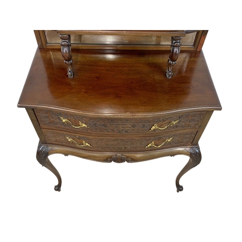 856 - A late Victorian mahogany display cabinet on chest. With Cabriole legs, open and closed Fretwork car... 