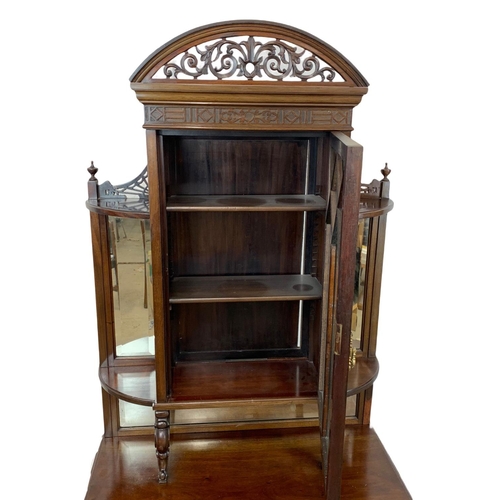 856 - A late Victorian mahogany display cabinet on chest. With Cabriole legs, open and closed Fretwork car... 