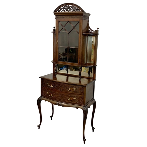 856 - A late Victorian mahogany display cabinet on chest. With Cabriole legs, open and closed Fretwork car... 