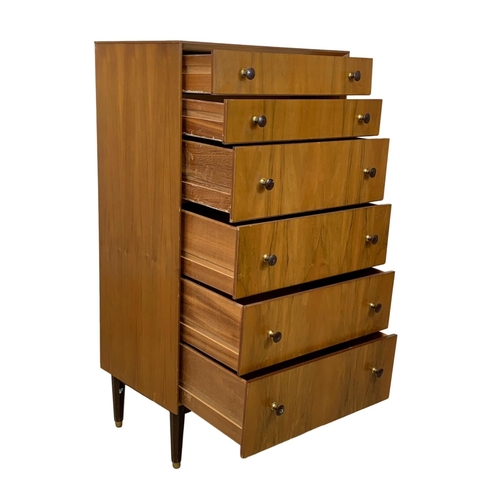 857 - A tall Mid Century chest of drawers. 1950-1960. 61.5 x 41.5 x 117.5cm.