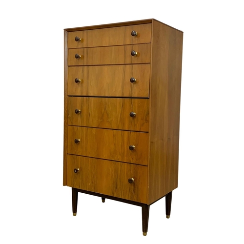 857 - A tall Mid Century chest of drawers. 1950-1960. 61.5 x 41.5 x 117.5cm.