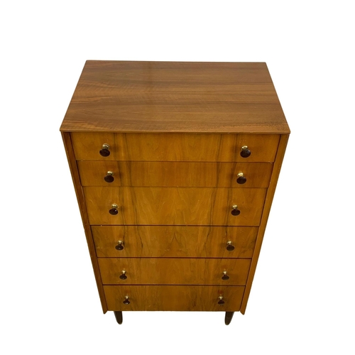 857 - A tall Mid Century chest of drawers. 1950-1960. 61.5 x 41.5 x 117.5cm.