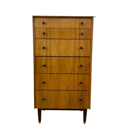 857 - A tall Mid Century chest of drawers. 1950-1960. 61.5 x 41.5 x 117.5cm.