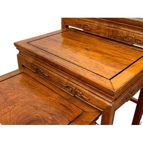 861 - A nest of 4 Chinese rosewood tables. Tallest 50.5 x 35.5 x 66cm.