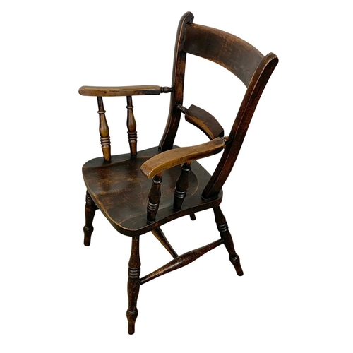 862 - A Victorian elm and beech Kitchen armchair