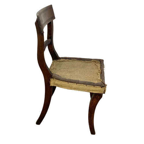 863 - A Georgian bar back side chair with sabre legs.