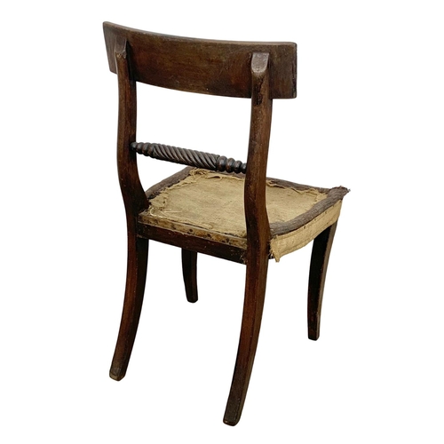 863 - A Georgian bar back side chair with sabre legs.