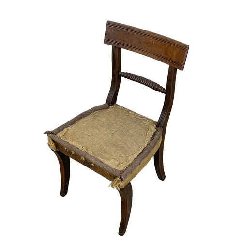 863 - A Georgian bar back side chair with sabre legs.