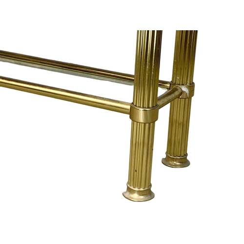 874 - A vintage Italian brass console table with 2 tier glass tops. 121 x 34 x 78cm