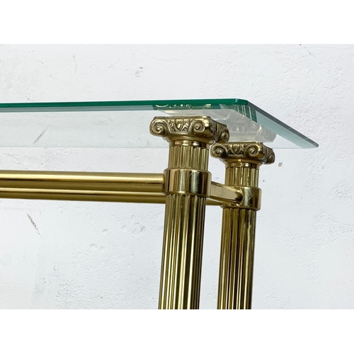 874 - A vintage Italian brass console table with 2 tier glass tops. 121 x 34 x 78cm